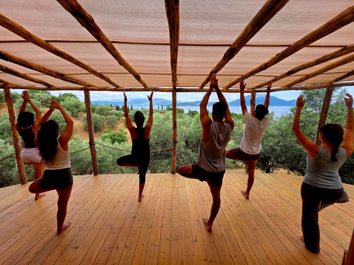 Yoga practice on the deck overlooking the sea