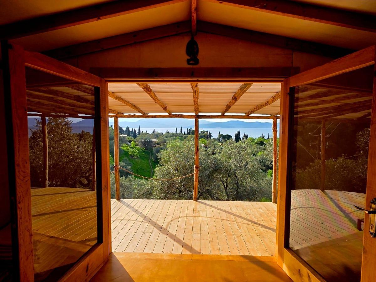 The studio doors open to the olive grove and sea