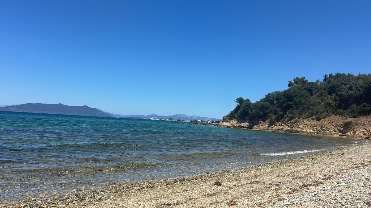 Pebble beach and clear water